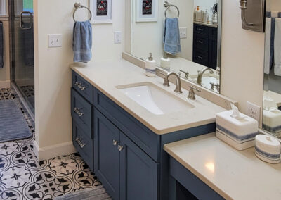 Primary bathroom addition with custom-tiled shower and custom-built vanity