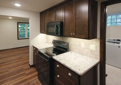 Basement finish after with new full kitchen and laundry room