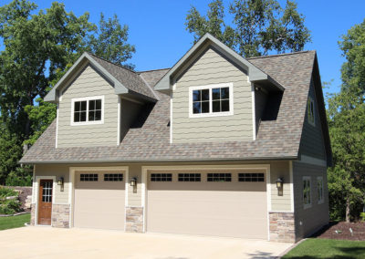 3 stall garage with bonus room with dormers, built by PortSide Builders.