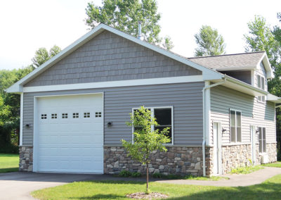 Single stall garage with additional storage and living space above. Built by Portside Builders in Door County, WI