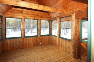 Traditional log cabin screen porch