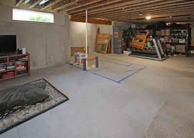 Unfinished basement before remodel.