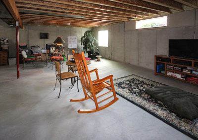 Unfinished basement before remodel.