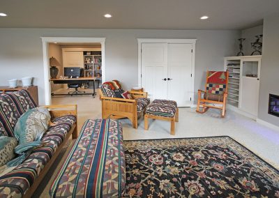 Basement finish with office with custom shelving