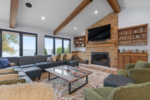 Stained Oak Cabinetry, Natural Stone Fireplace, Mixed Texture & Pattern Furniture