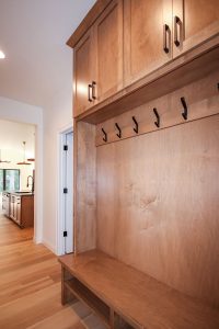 Mudroom with Bench with Hooks and Cabinets Above