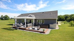 Back Exterior of custom-built home in northeast Wisconsin, with Pergola Covered Patio