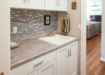 Mudroom with laundry room and drop-in sink, custom-built home in northeast Wisconsin